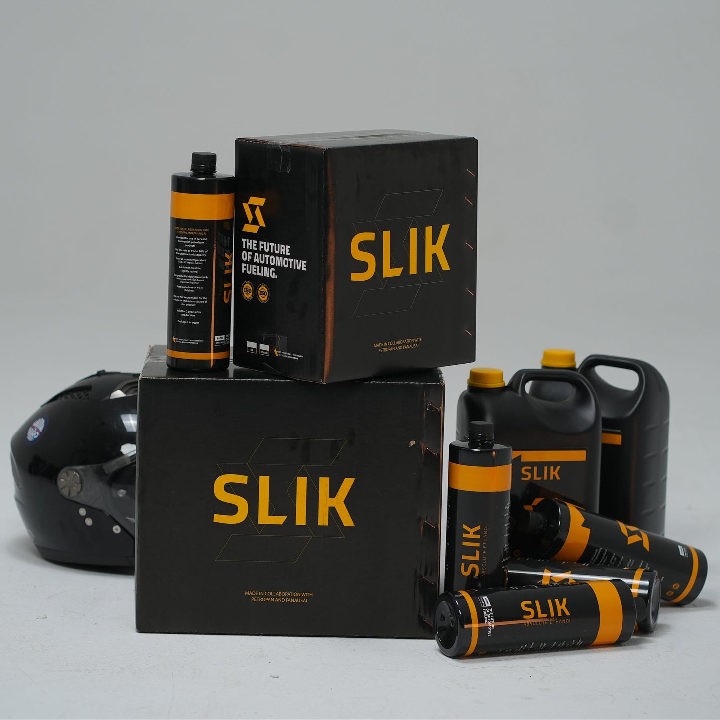 SLIK hair products including bottles and boxes on a gray background