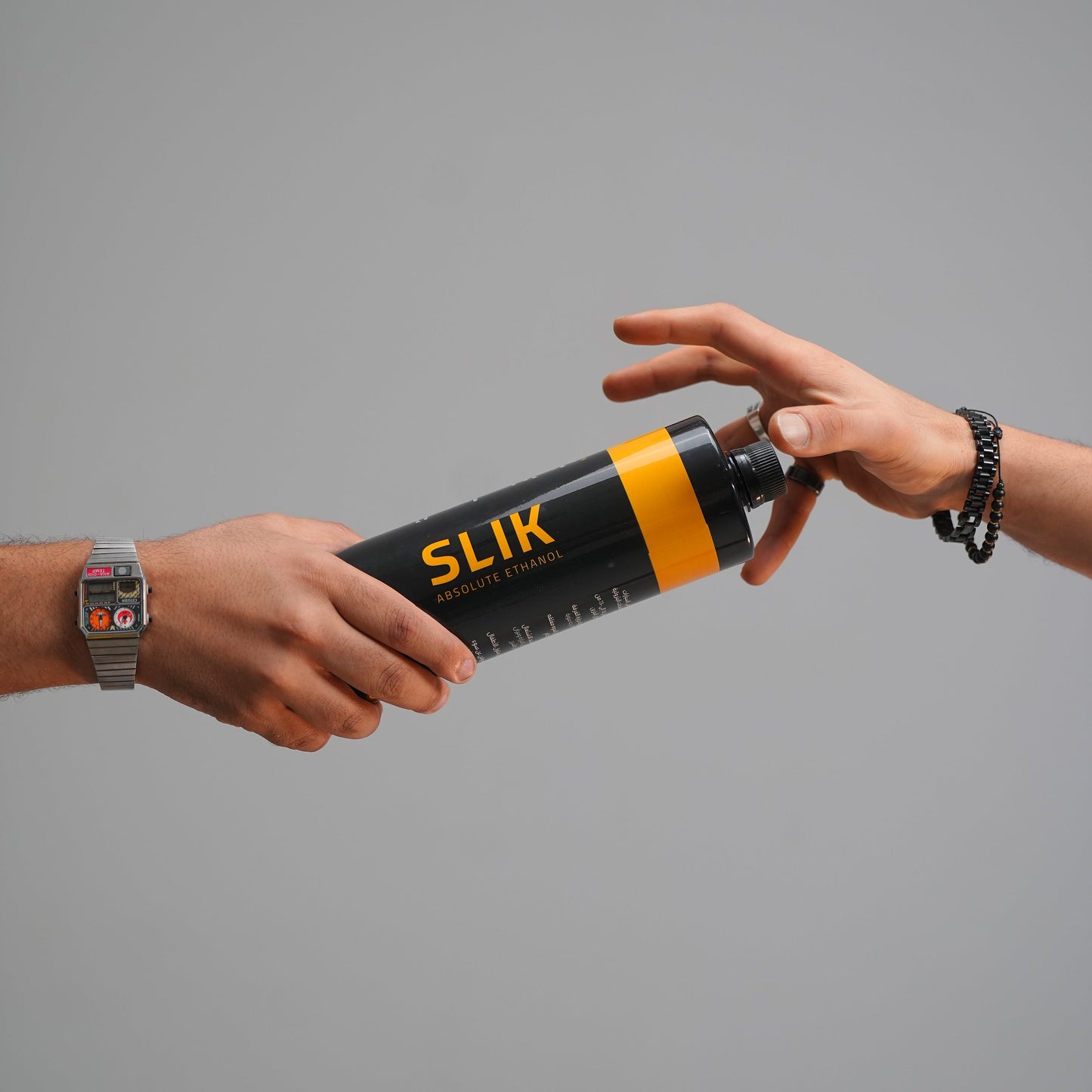 Person holding a SLIK product against a gray background